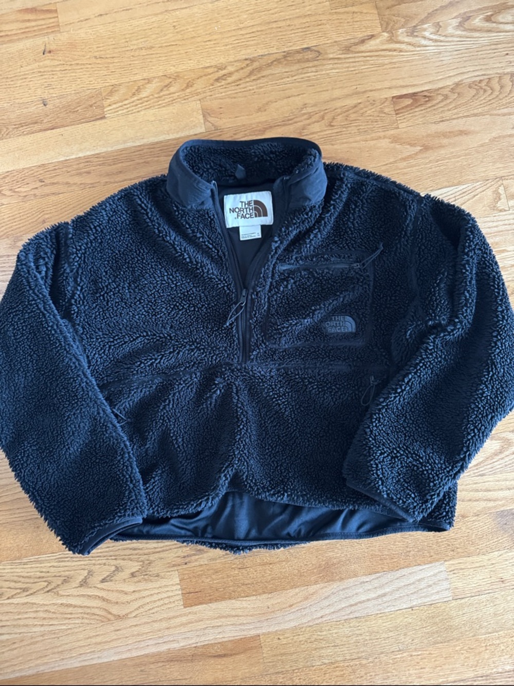The North Face Black Sherpa Fleece Half-Zip Pullover with zipper pockets